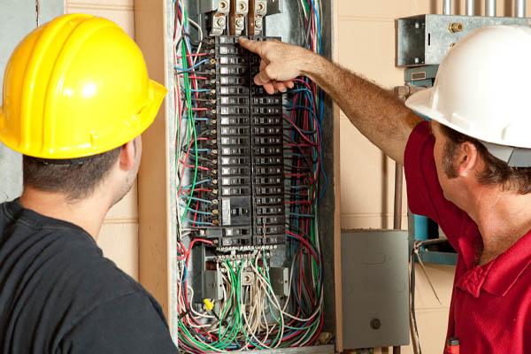 image of hvac technician checking furnace circuit
