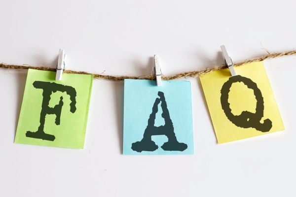 FAQ stamped on colored paper and clipped on a thin rope depicting HVAC Emergencies FAQs