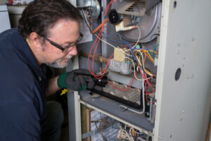 image of an hvac contractor performing a furnace installation