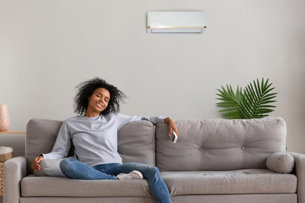 woman enjoying her ductless mini-split system