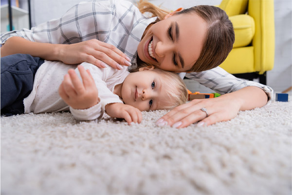 image of a family on carpet depicting indoor air quality