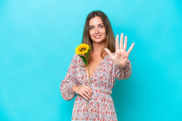 woman holding 5 fingers up depicting HVAC Service Myths