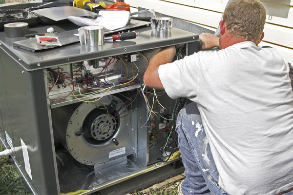 image of an hvac contractor performing air conditioner tune-up