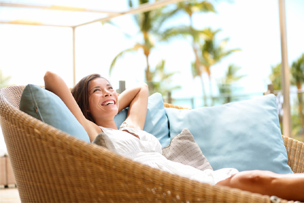 image of homeowner relaxing and feeling comfortable after air conditioner replacement