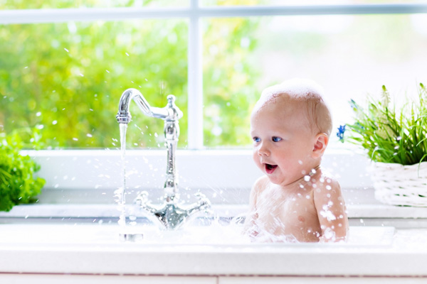 image of a child in bath heated by oil water heater