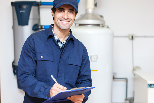 image of a technician installing propane water heater