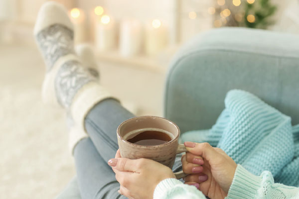 image of homeowner feeling comfortable with propane heat