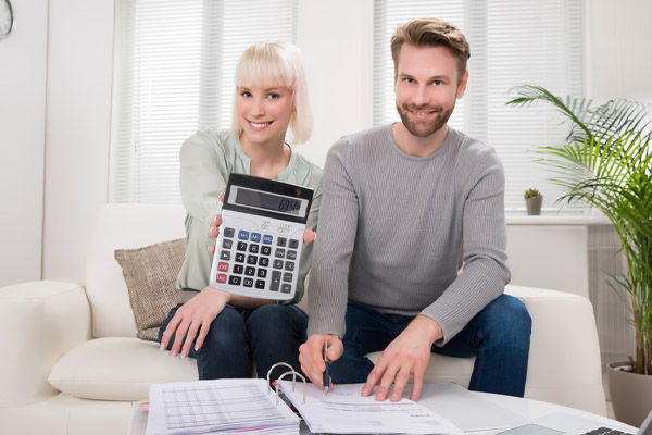 happy man counting savings after installing new furnace with high afue rating