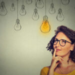 image of a woman with light bulb depicting decision about automatic vs will call propane delivery