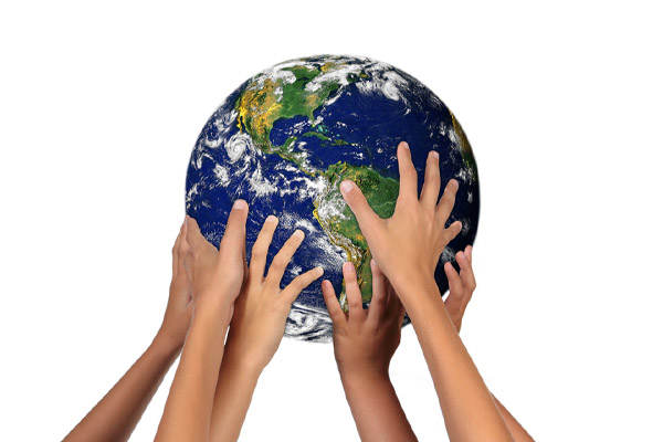 image of young children holding earth depicting environmental impact of heating systems