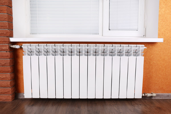image of heating radiator in room that is powered by home heating oil