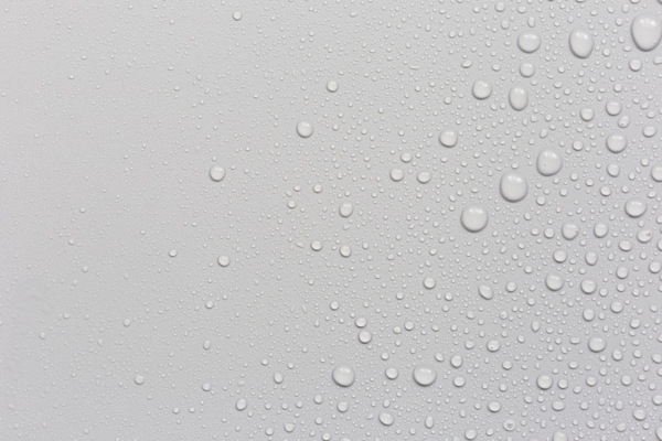 image of water droplets on a surface depicting condensation