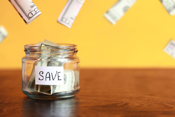 image of money in jar depicting save money on home heating oil costs