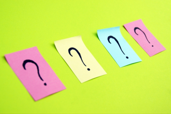 question marks on colored sticky notes depicting Furnace Repair Company FAQs