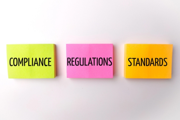 compliance regulations standards all written on different colored sticky notes depicting propane