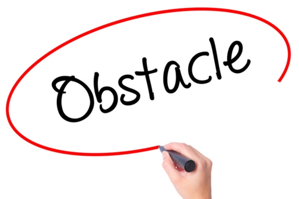 obstacle written on a paper using a marker depicting Overcoming Common Cooling System Installation Obstacles