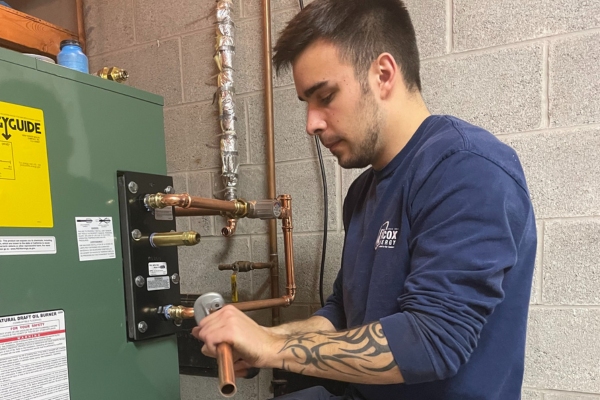 Wilcox Energy HVAC technician installing a heating system