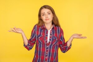 woman shrugging with both hands on the side asking what size heating system do I need