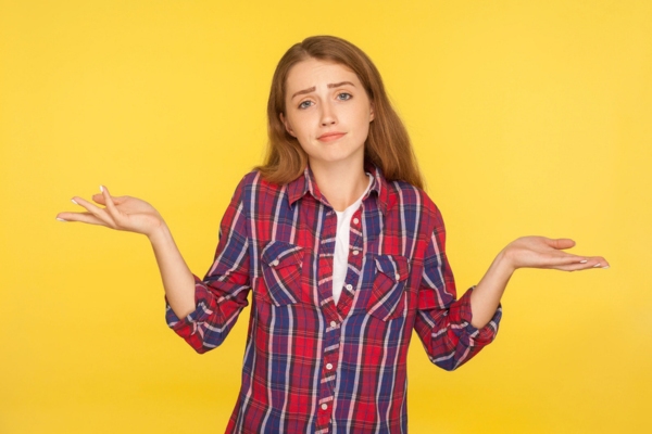 woman shrugging with both hands on the side asking what size heating system do I need