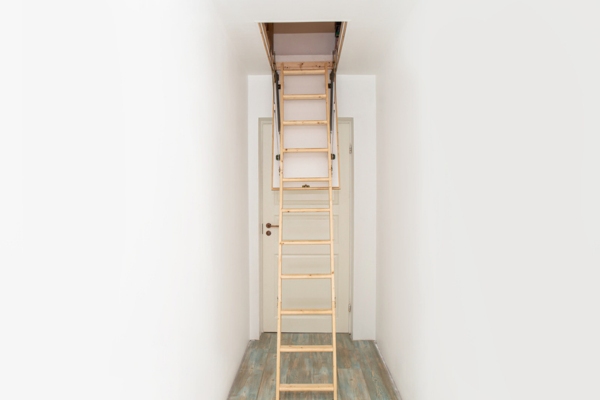 Wooden foldable pull up attic stairs ladder depicting common spots for air leaks