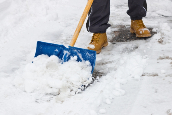 homeowner shoveling snow