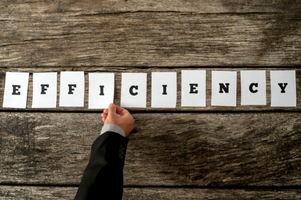 man assembling the word efficiency using letters printed on paper depicting Propane Performance