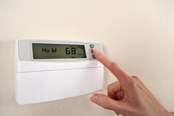 adjusting home thermostat