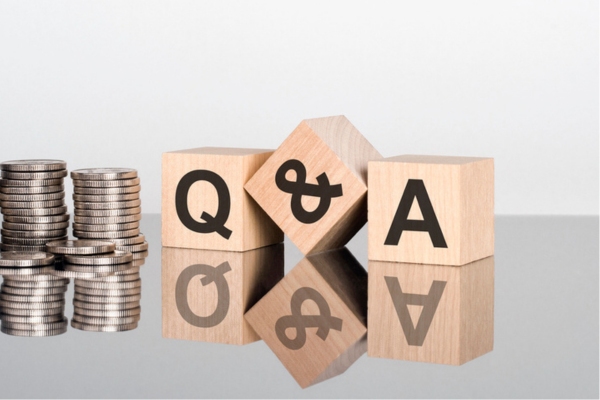 Q&A written on a wooden cube depicting FAQs About Air Conditioning and Health Effects