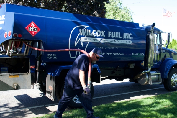 Wilcox Energy oil delivery truck and staff