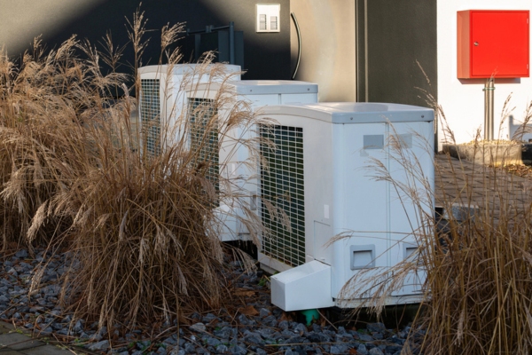 air conditioner units beside plants