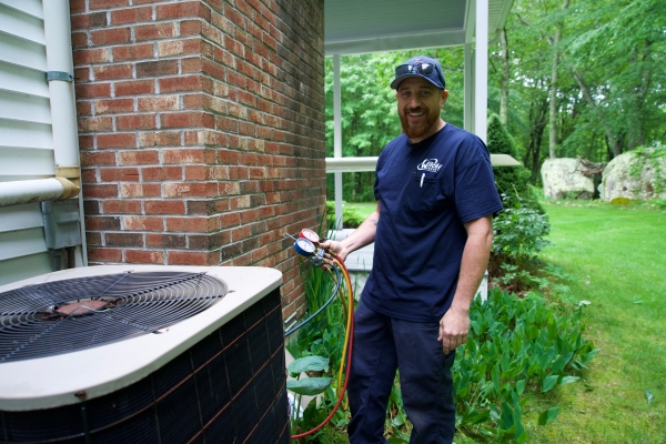 Wilcox Energy AC service technician tending to a unit