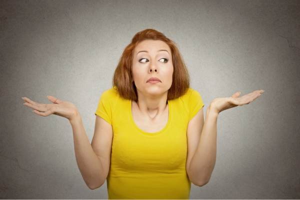 clueless woman with arms out and shrugging shoulders depicting What to Do If You Are Concerned About Rising Heating Costs