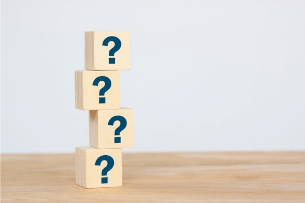 question marks on wooden letter cubes depicting HVAC Airflow FAQs