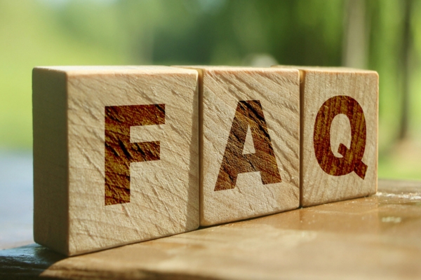 FAQ spelled using wooden letter chips depicting AI in HVAC questions