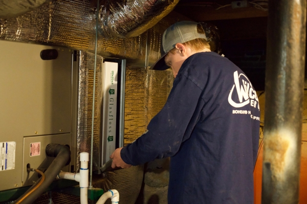 Wilcox Energy trusted HVAC technician preparing furnace for winter