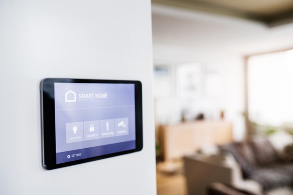 smart home control tablet installed on a wall